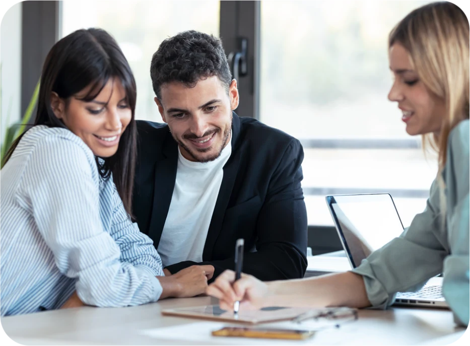 Financial advisor meeting with clients, using reputation management tools to grow their financial services business.