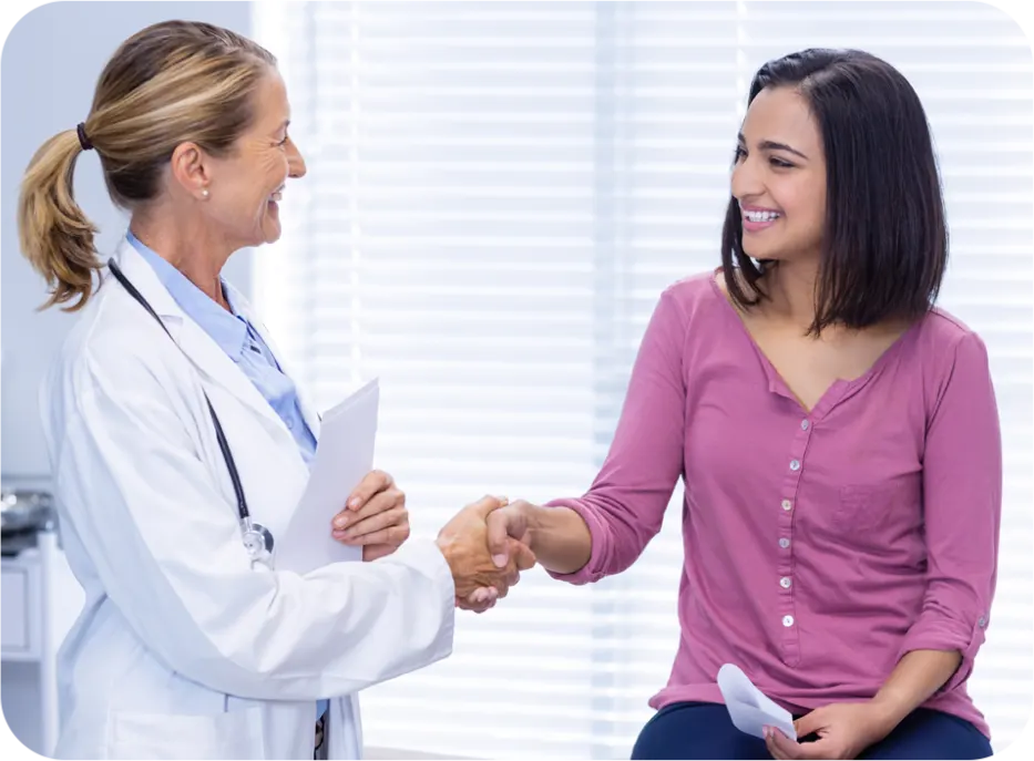 Doctor greeting a patient in a medical practice.