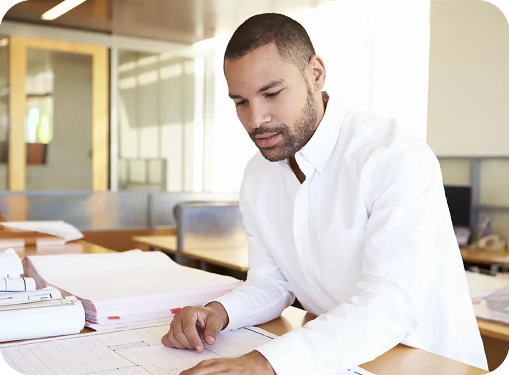 Professional reviewing documents in an office.