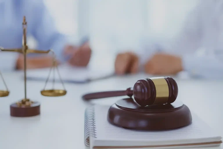 Gavel and legal documents on a desk representing Avvo law firm reviews.
